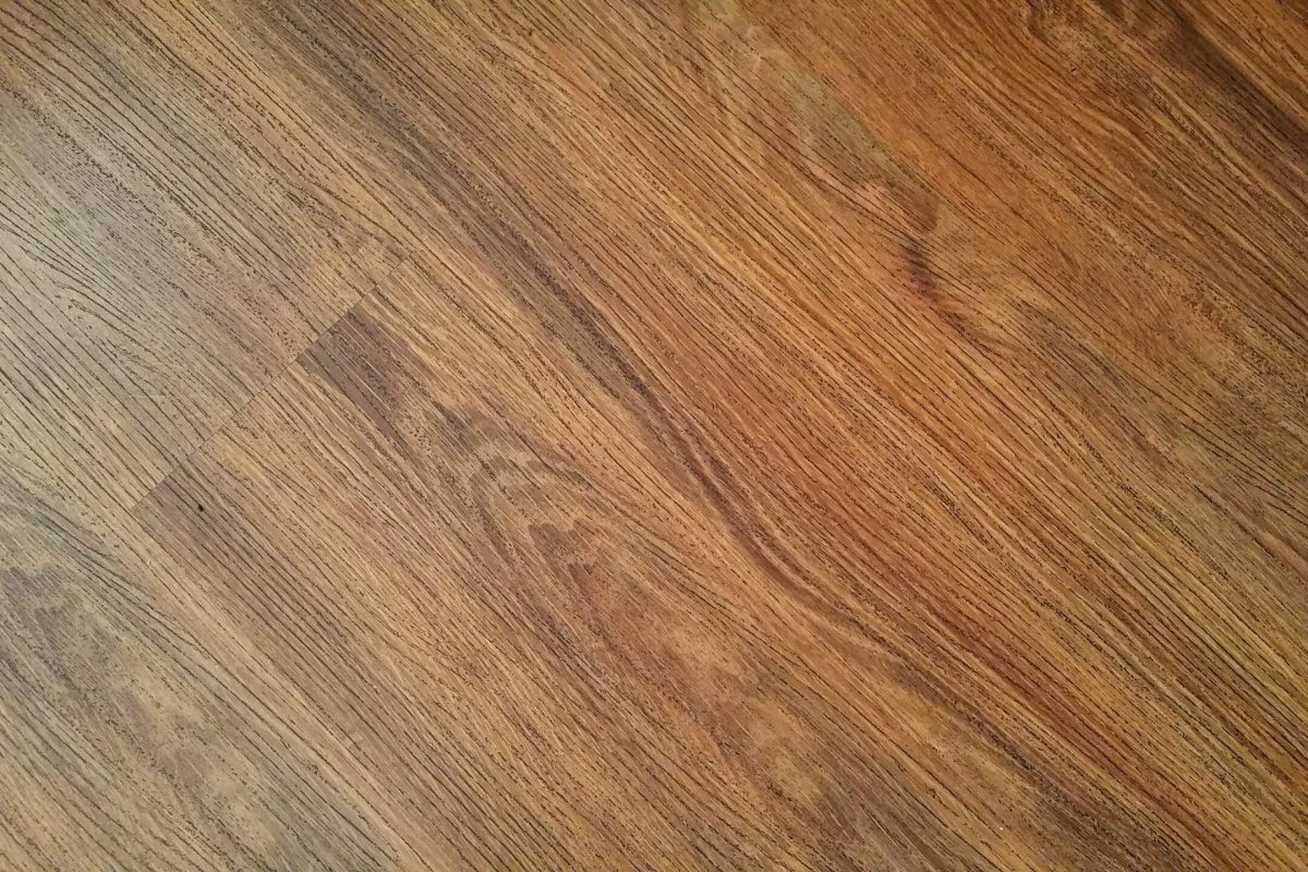 Detailed image of rustic wooden flooring with visible wood grain texture.